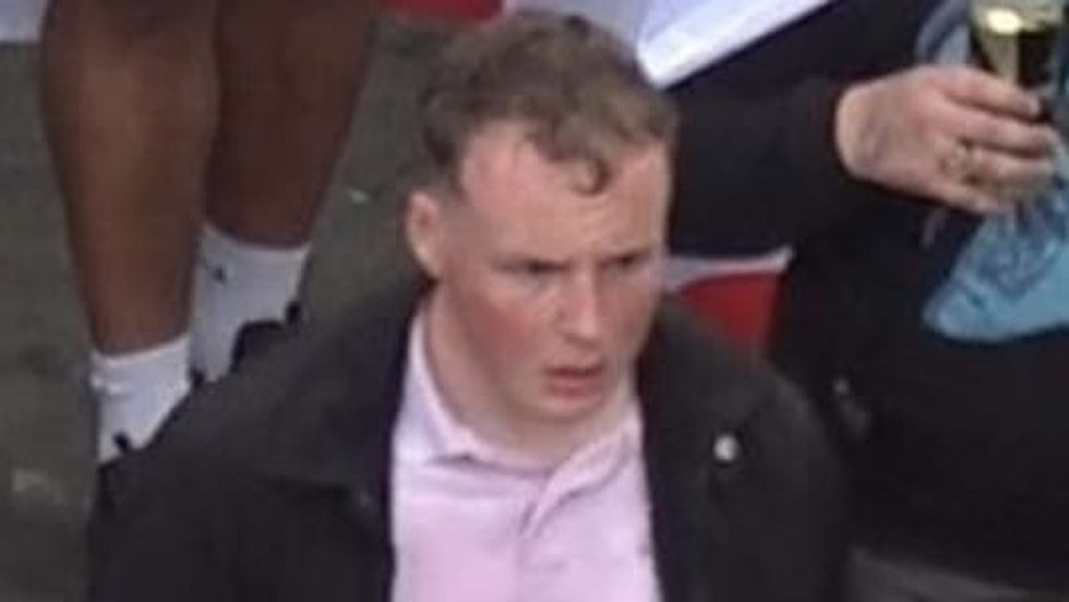 Photo issued by the Metropolitan Police of a man wanted in connection with violence and disorder that took place during the Euro 2020 final in London on Sunday July 11