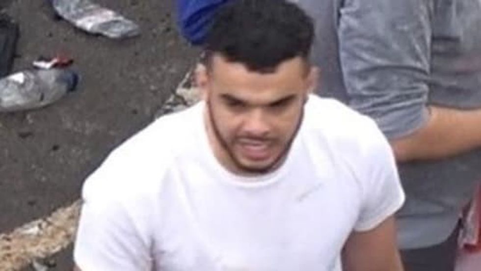 Photo issued by the Metropolitan Police of a man wanted in connection with violence and disorder that took place during the Euro 2020 final in London on Sunday July 11