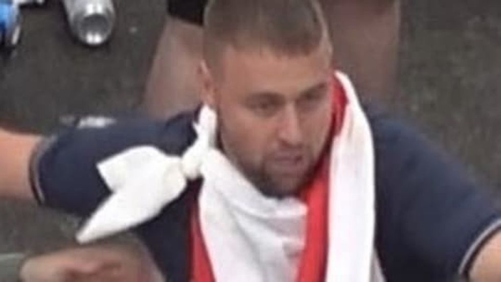 Photo issued by the Metropolitan Police of a man wanted in connection with violence and disorder that took place during the Euro 2020 final in London on Sunday July 11
