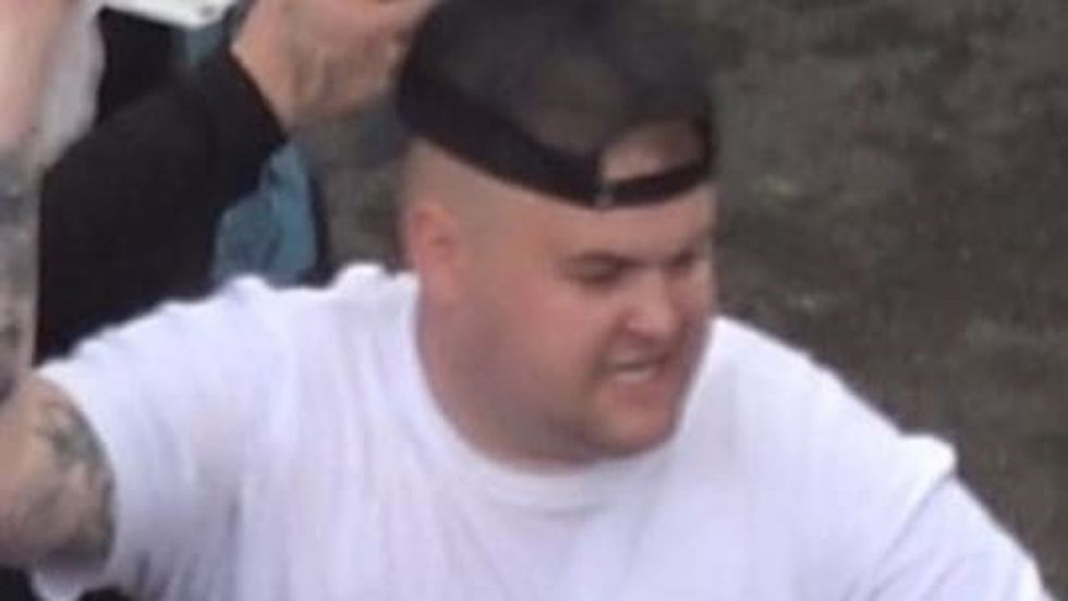 Photo issued by the Metropolitan Police of a man wanted in connection with violence and disorder that took place during the Euro 2020 final in London on Sunday July 11