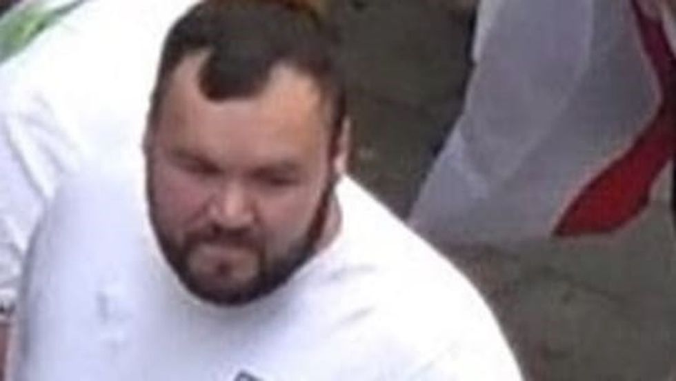 Photo issued by the Metropolitan Police of a man wanted in connection with violence and disorder that took place during the Euro 2020 final in London on Sunday July 11