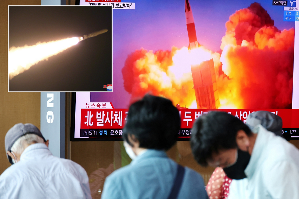 Photo of people watching missile launch with inset of missile launch