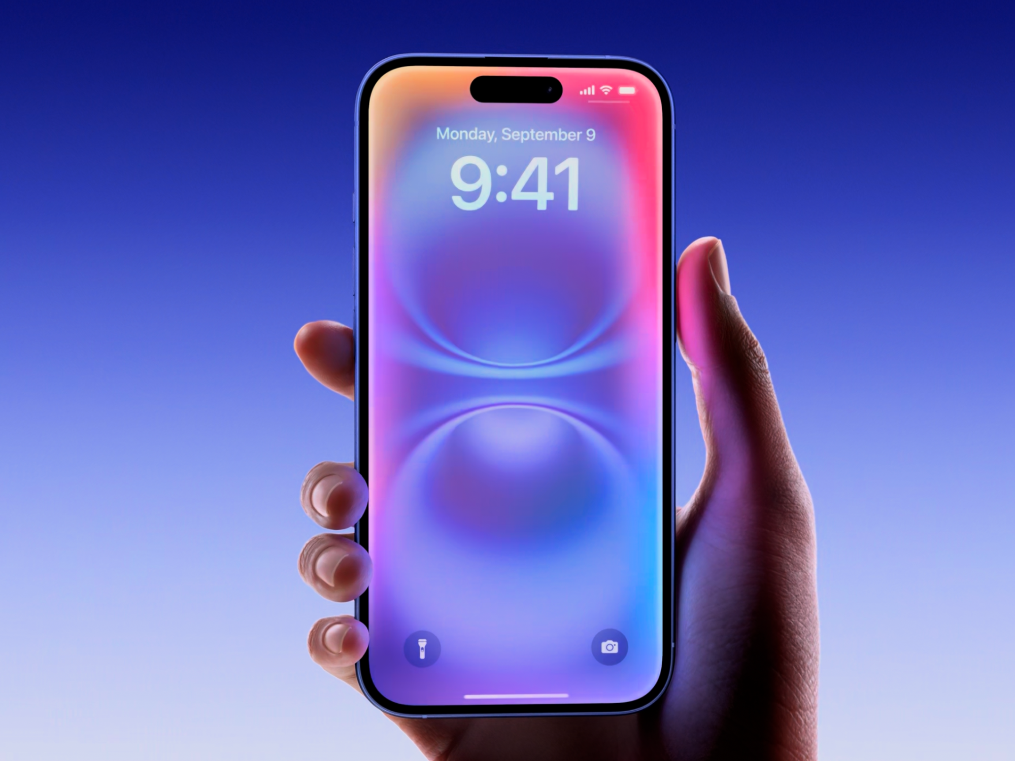 picture of a hand holding the iphone 16 with new siri effect on-screen