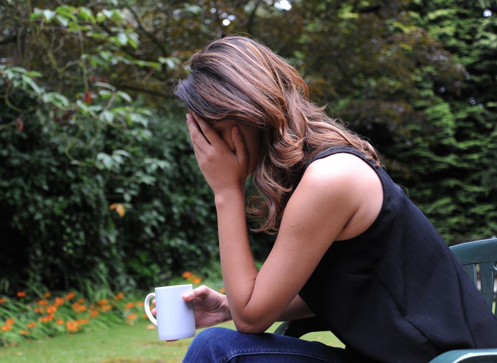 PICTURE POSED BY MODEL. A woman showing signs of depression.