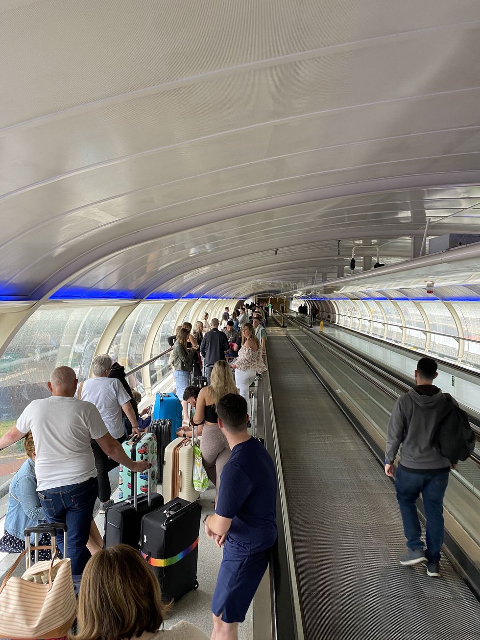 Picture taken with permission from the twitter feed of @chrisjprice67 of people queuing at Manchester Airport, as Tui has announced a %22small number%22 of flight cancellations and delays in a blow to travel plans at the start of the half-term break. Issue date: Monday May 30, 2022.