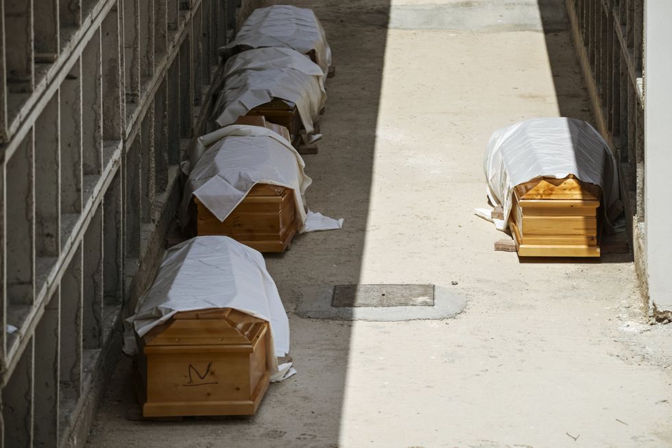PICTURED: Some of the coffins of the migrants who died at sea last year attempting to cross the Mediterranean