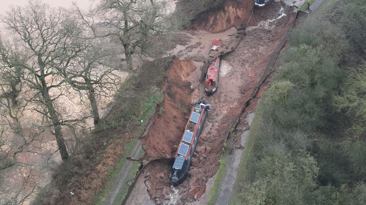 PICTURED: Three boats stranded after being swallowed by sinkhole in major incident