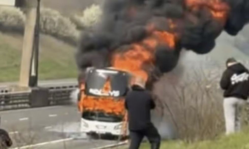 Pictures emerged of a coach engulfed in flames en route to Wembley