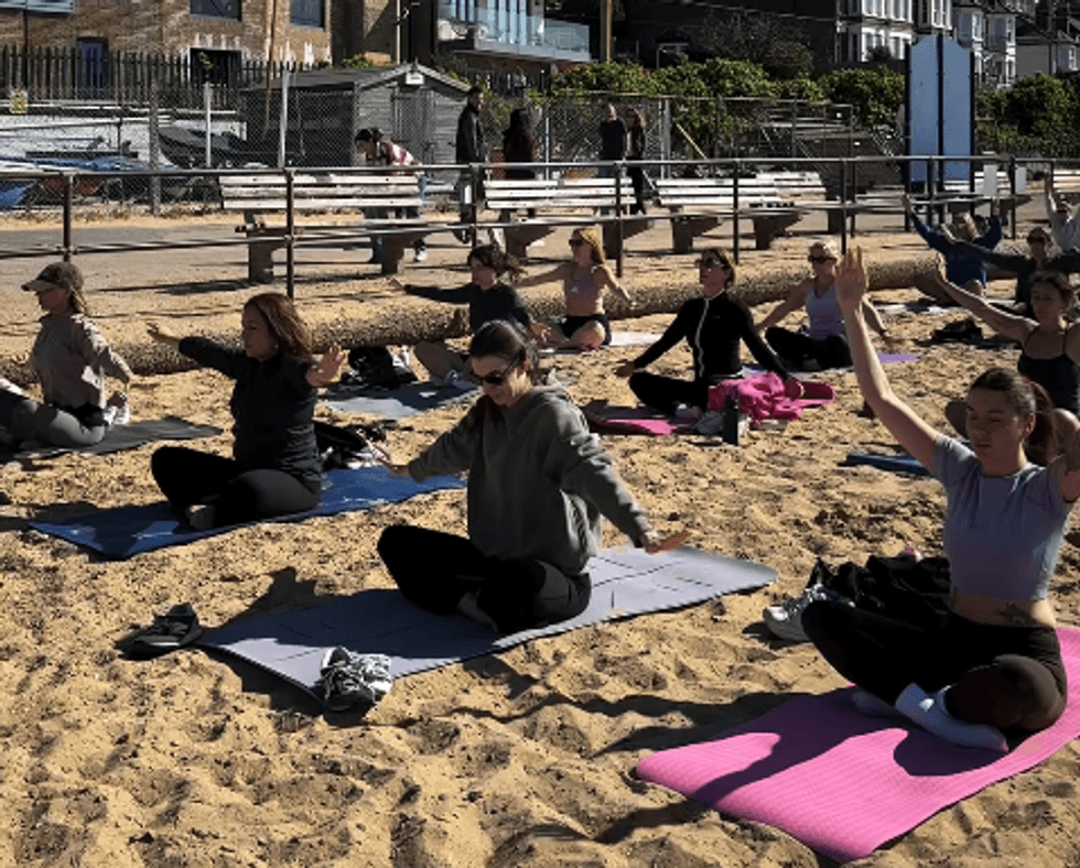 pilates class on the beach