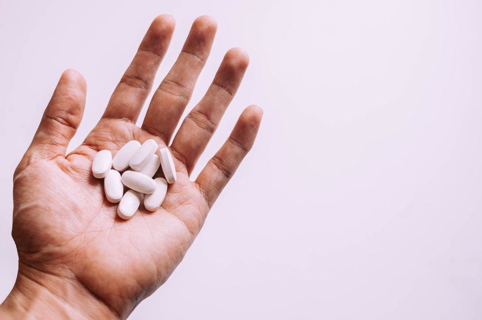 PILLS IN HAND