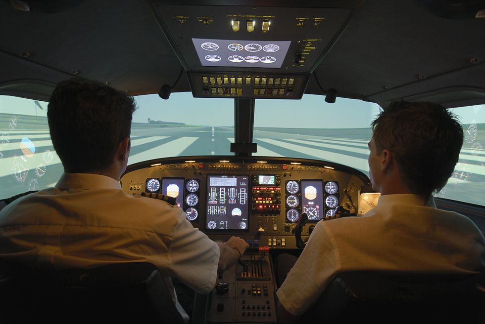 Pilots taxing on airport runway