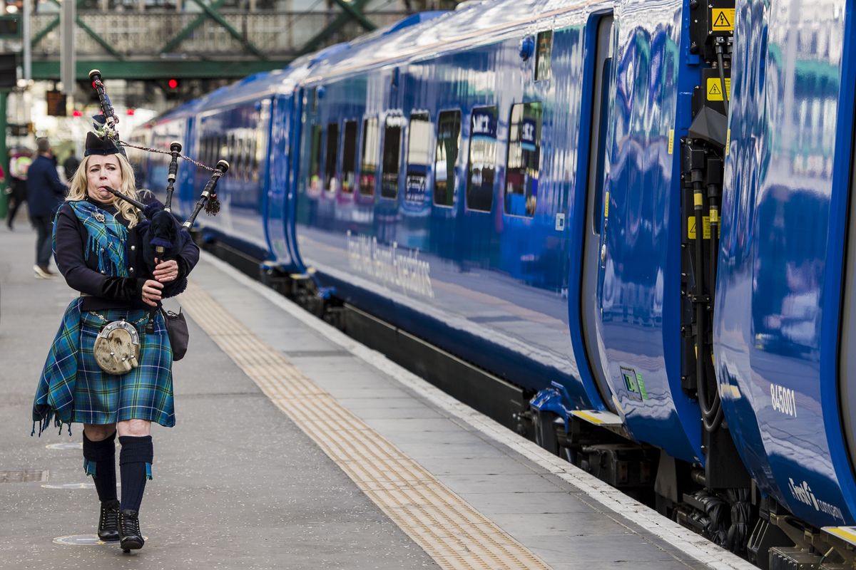 Piper marking the inaugural journey of the Lumo train service at Edinburgh Waverley Station in October 2021.