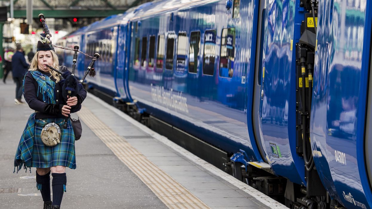 Piper marking the inaugural journey of the Lumo train service at Edinburgh Waverley Station in October 2021.