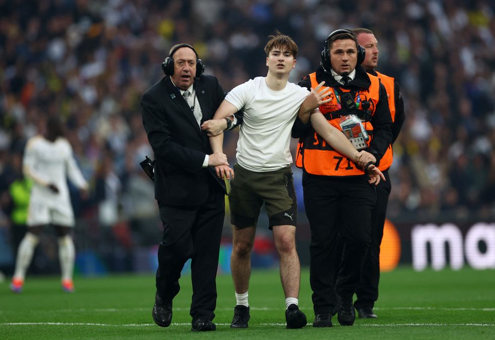 Pitch invaders broke onto the field at Wembley