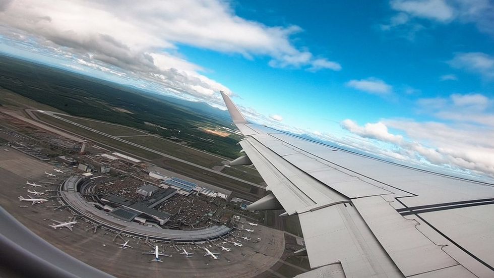 Plane above New Chitose airport, Japan