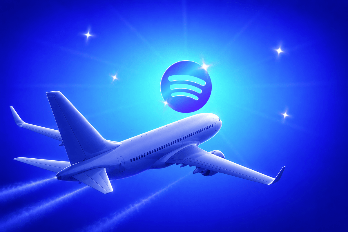 Plane flying next to Spotify logo