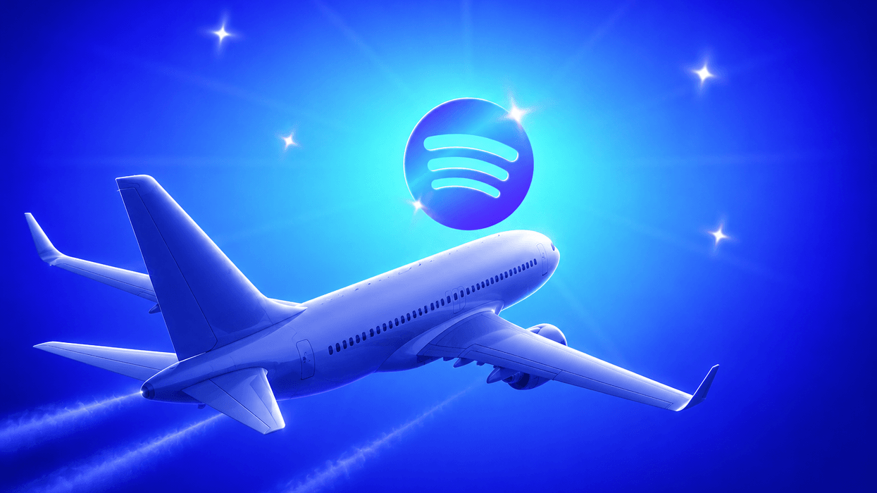 Plane flying next to Spotify logo