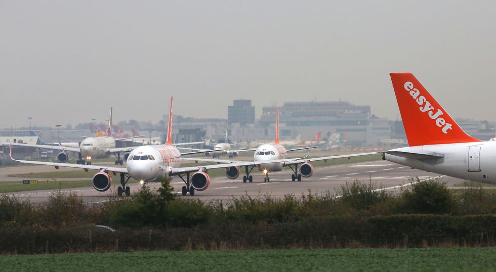 Planes parked along an airport runway