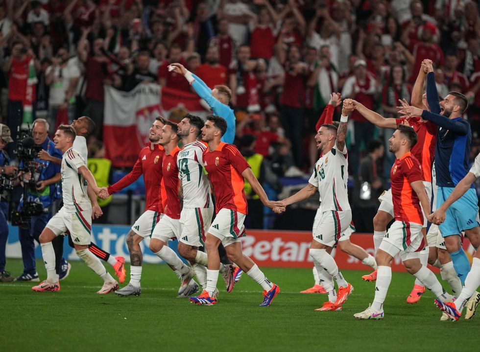 Players of Hungary celebrate at the end of their match against Scotland