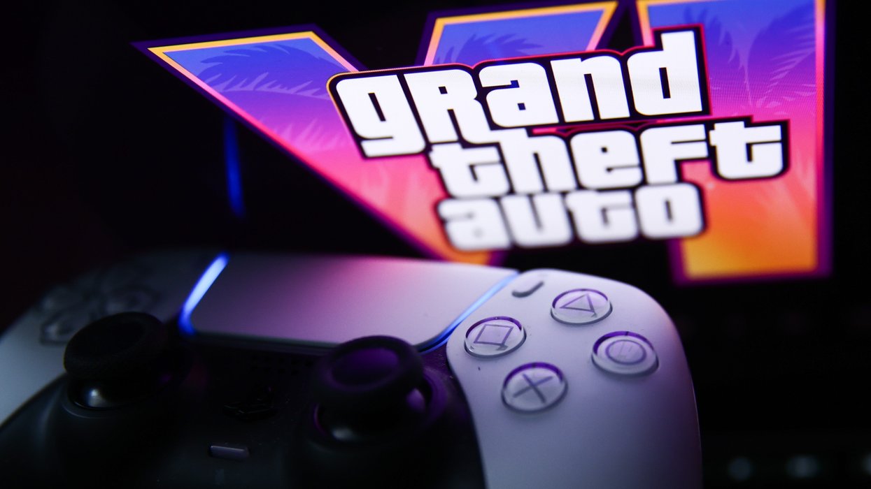 playstation 5 controller pictured next to the Grand Theft Auto logo