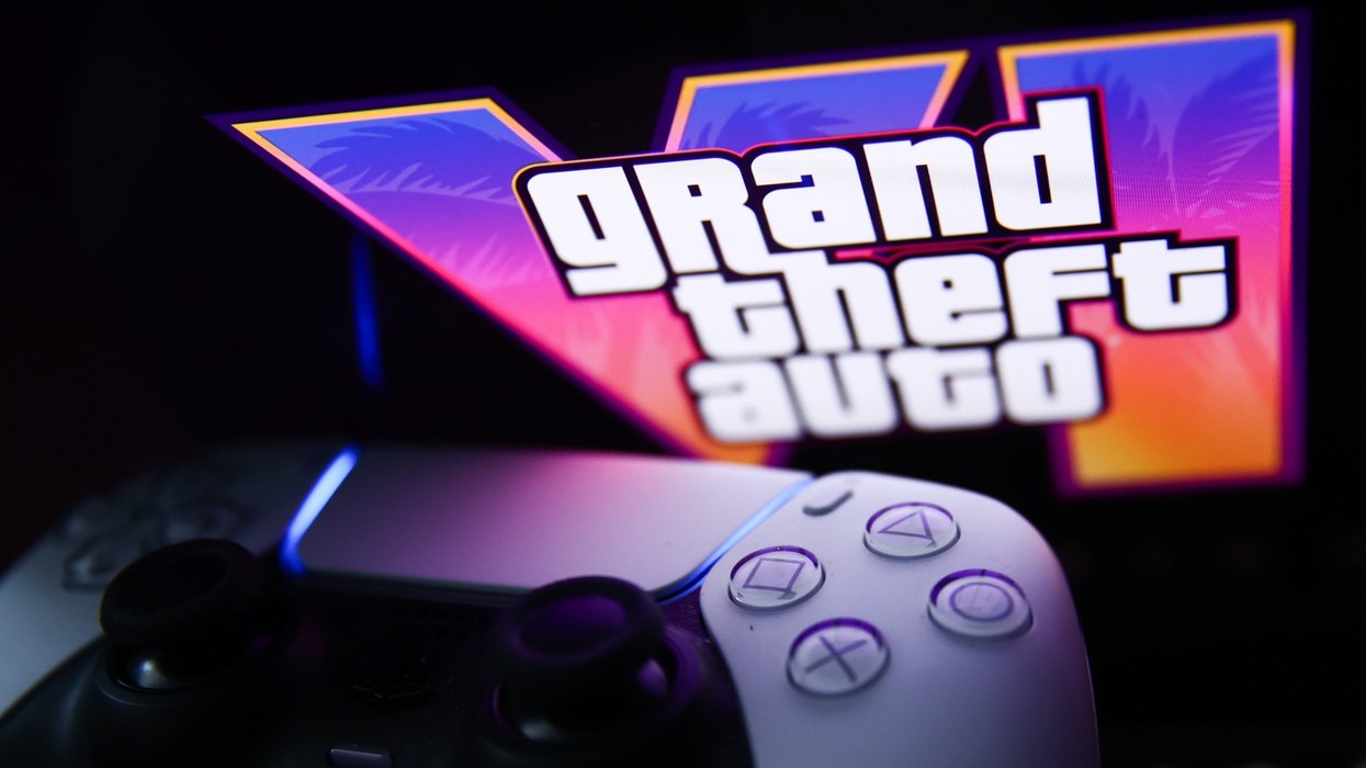 playstation 5 controller pictured next to the Grand Theft Auto logo