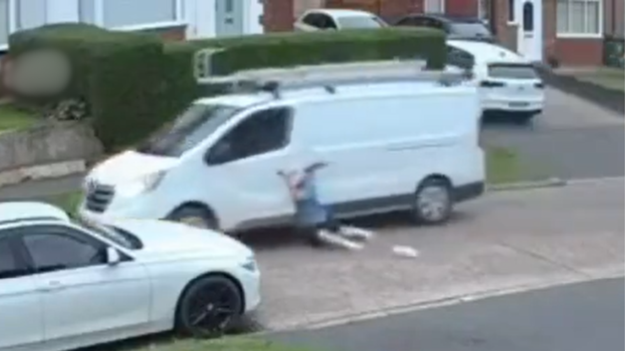 Plumber dragged along road