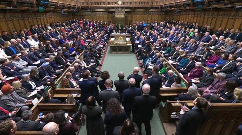 Mobile phones will be BANNED by law in England's schools to 'put children’s interests first'