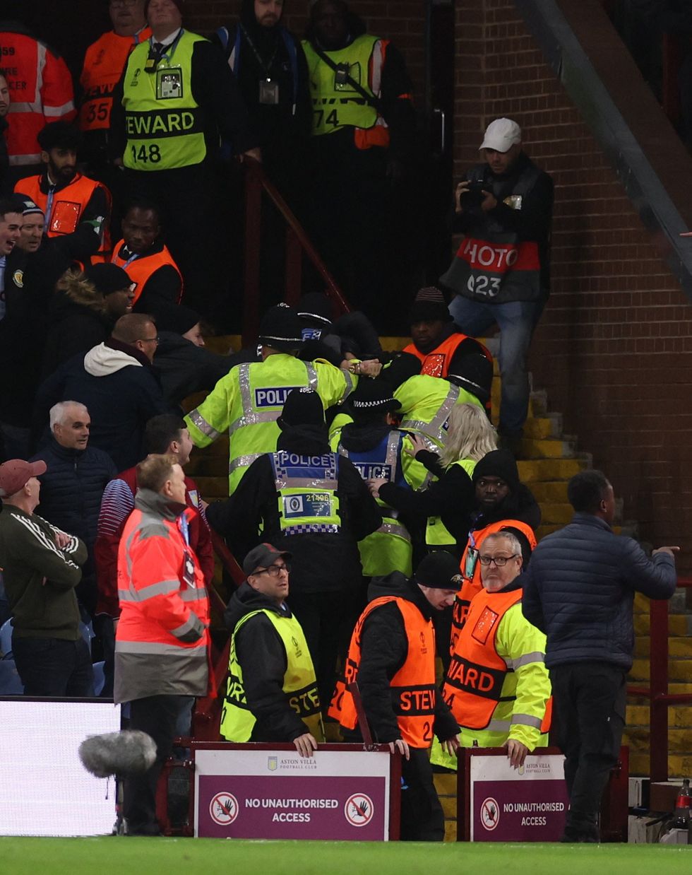 Police apprehended at least one supporter during the fracas, in which missiles were thrown at the authorities as well as the police