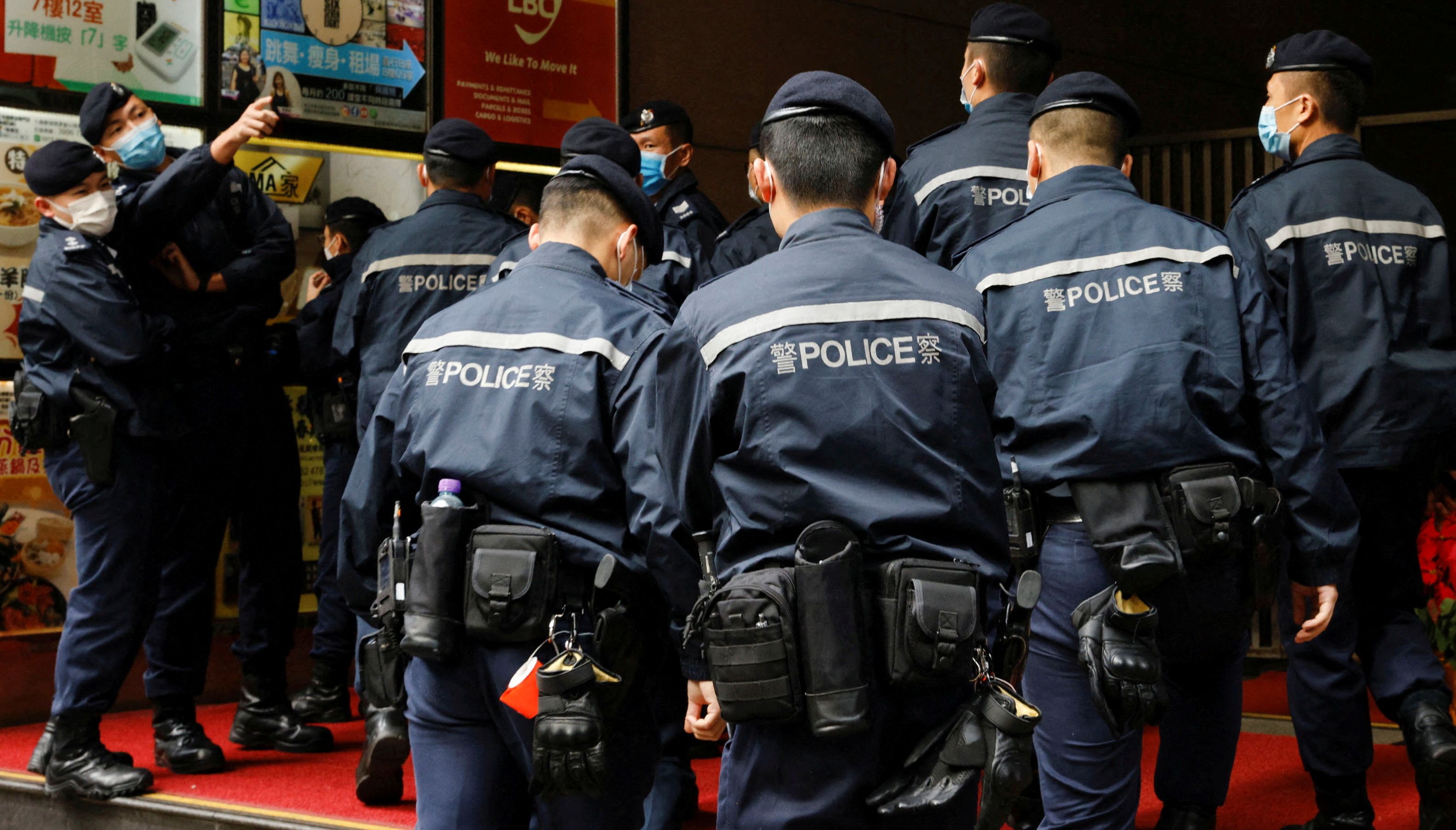 Police are seen outside the Stand News office building, after six people were arrested %22for conspiracy to publish seditious publication%22 according to Hong Kong's Police National Security Department, in Hong Kong, China