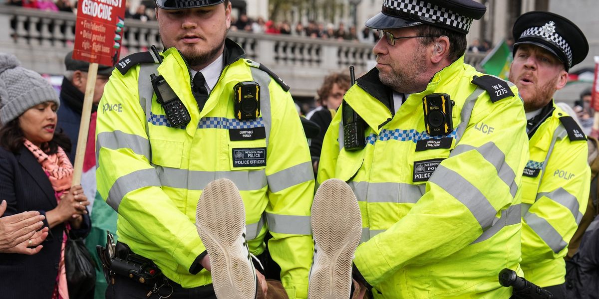 Met Police arrest more than 200 protesters supporting banned terror group Met Police arrest more than 200 protesters supporting banned terror group