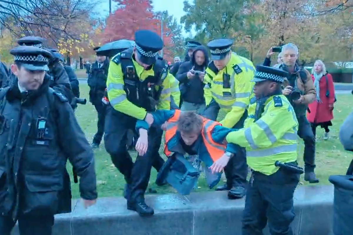 Police arresting a protester