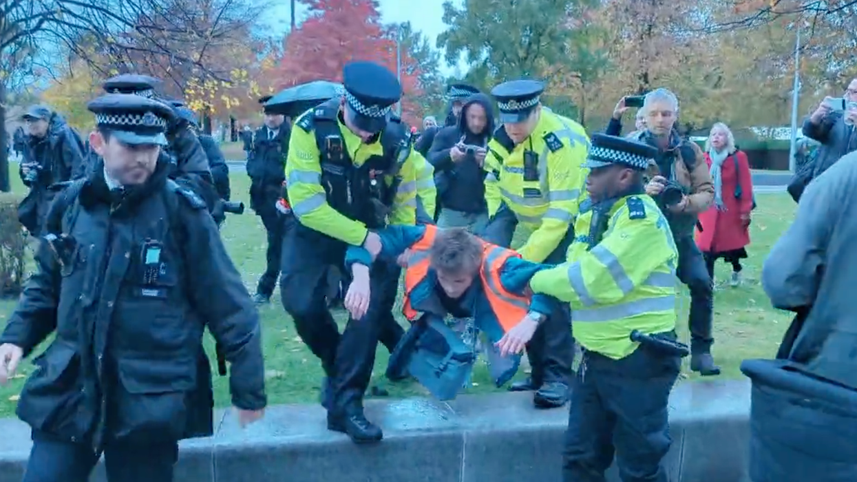 Police arresting a protester