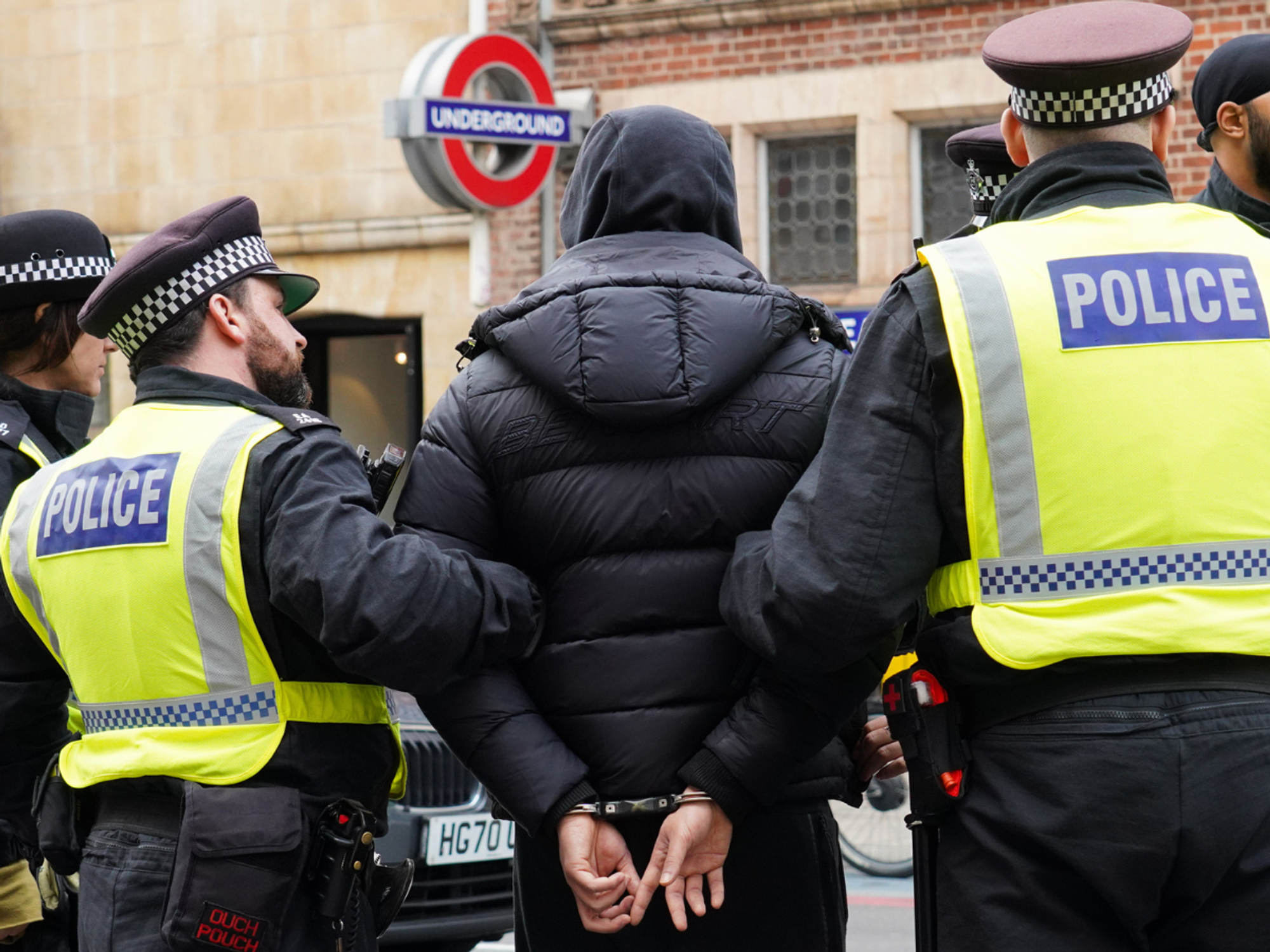 Police arresting man in London