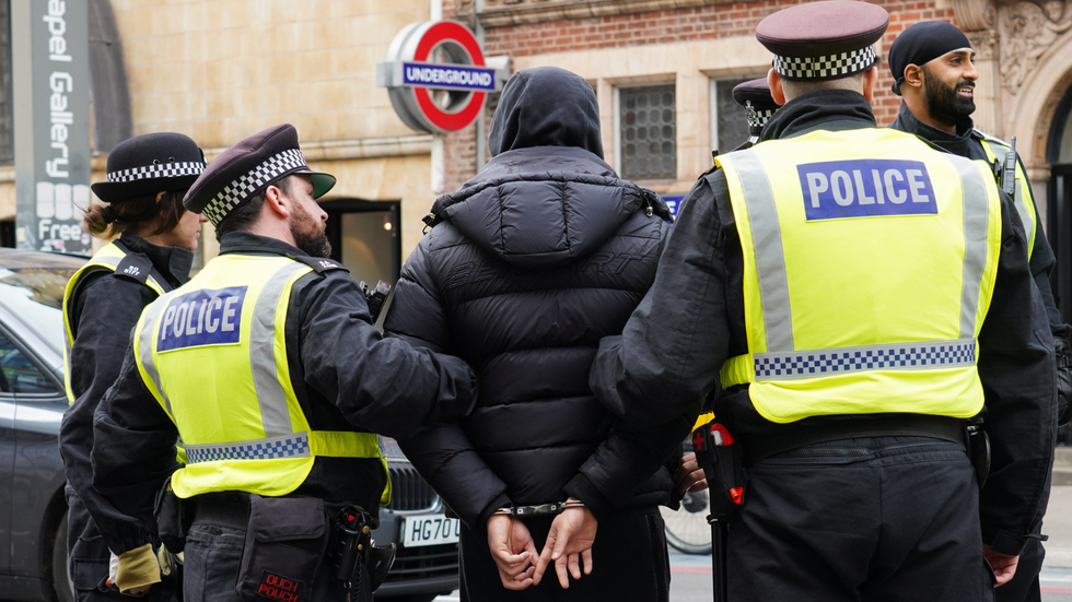 Police arresting man in London
