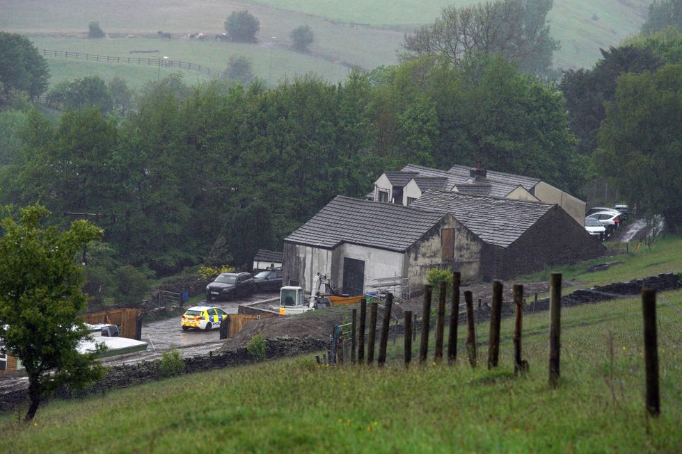 Police at a building in Milnrow, Rochdale.