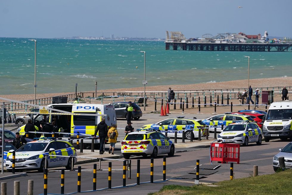 Police at Brighton beach after three women were pulled from the water