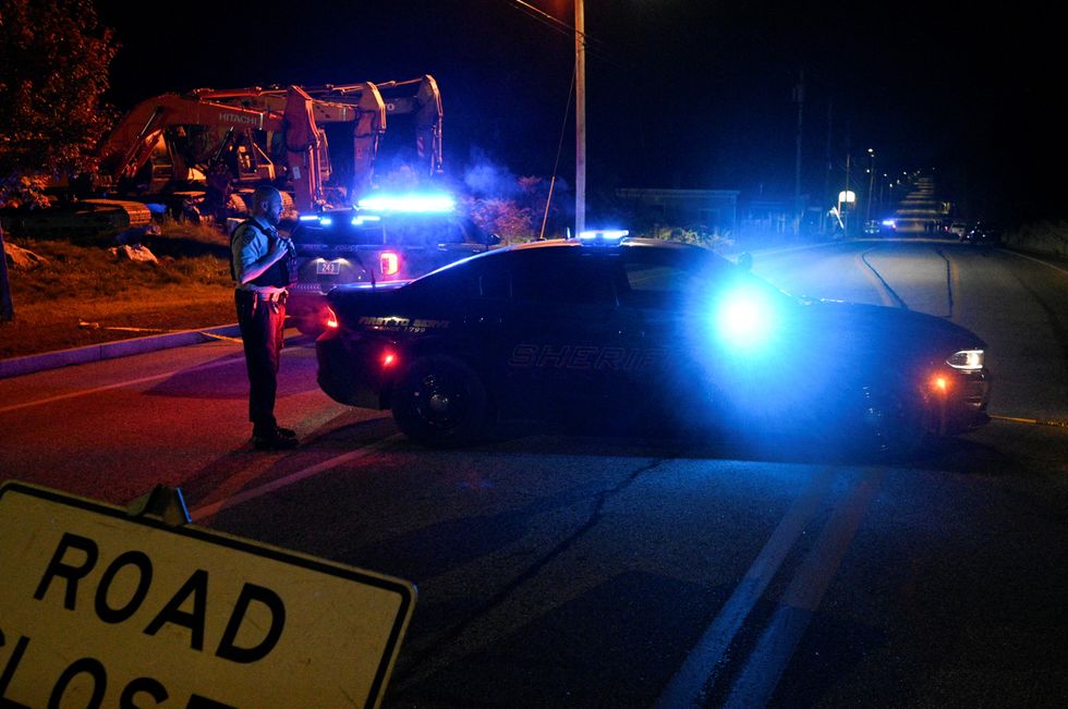Police at scene after shooter opened fire on bowling alley and then a bar in Lewiston, Maine.