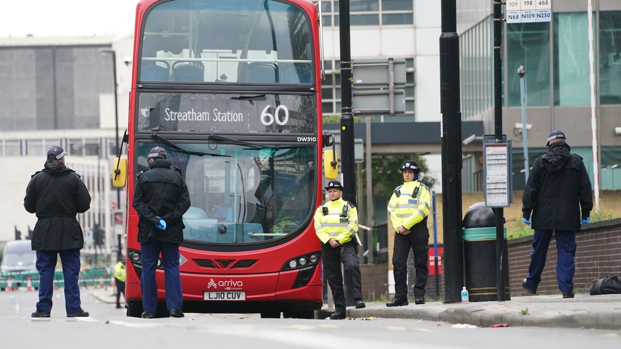 Police at the scene in Croydon, south London, where a 15-year-old girl was stabbed to death on Wednesday morning