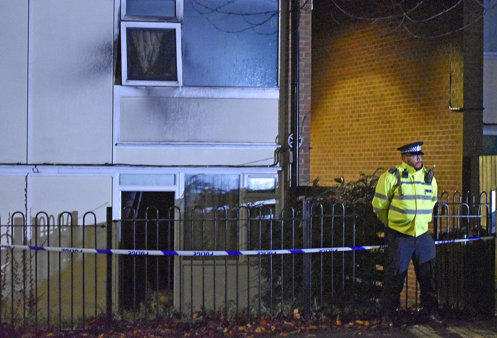 Police at the scene in Nottingham after two children died and a woman was left critically injured in a fire at a flat. Picture date: Sunday November 20, 2022.