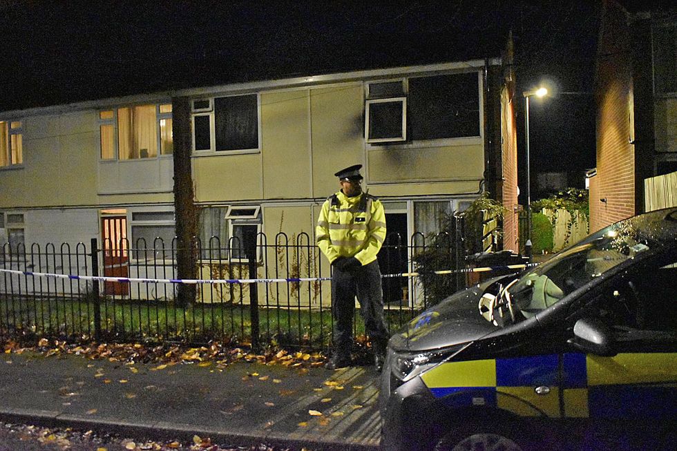Police at the scene in Nottingham after two children died and a woman was left critically injured in a fire at a flat. Picture date: Sunday November 20, 2022.