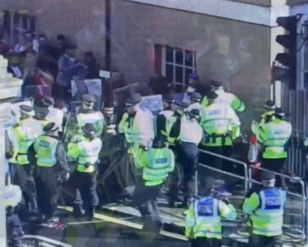 Police blocking protesters with shields