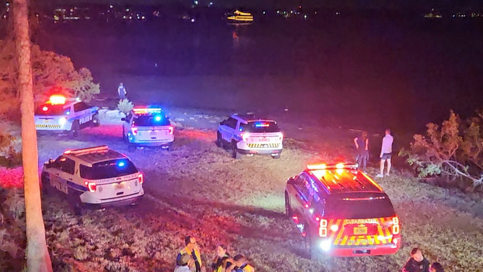Police by shore in Florida