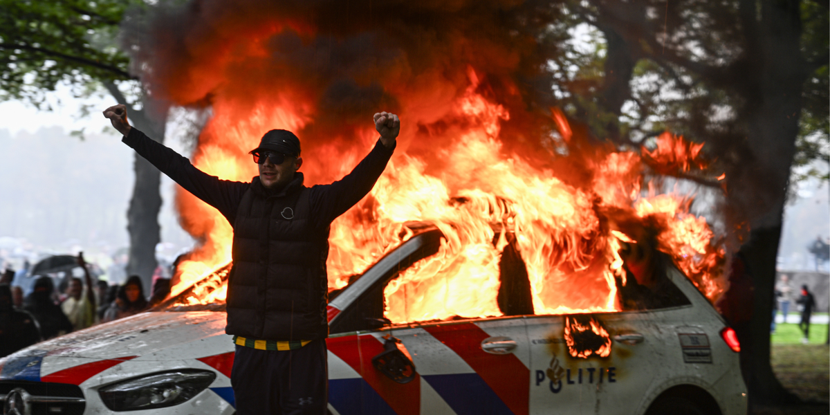 NextImg:Migrant protests rock European city as police cars set ablaze and officers injured