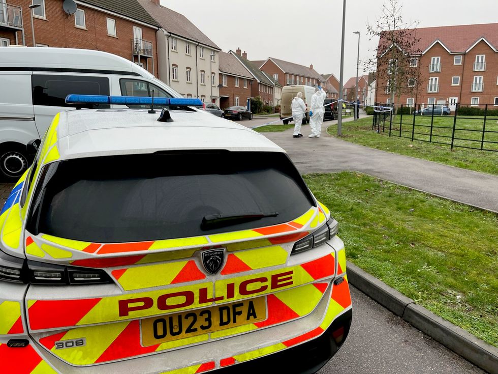 Police cars at the scene near an apartment block on Santa Cruz Avenue