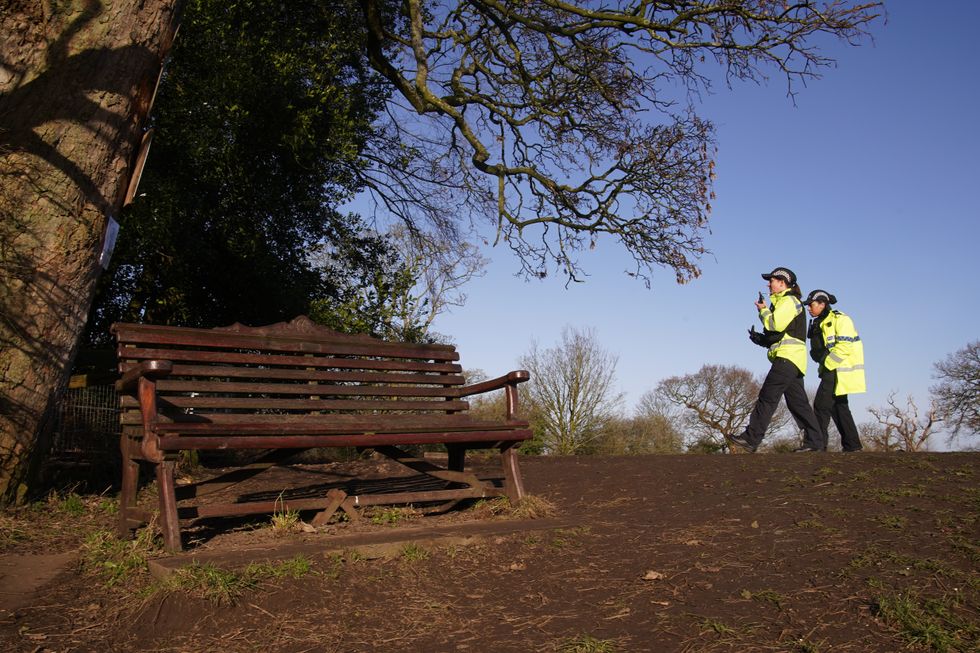Police community support officers walk past the bench where Nicola Bulley's phone was found, on the banks of the River Wyres in St Michael's on Wyre, Lancashire, as police continue their search for missing woman Nicola Bulley, 45, who was last seen on the morning of Friday January 27, when she was spotted walking her dog on a footpath by the nearby River Wyre. Picture date: Thursday February 9, 2023.