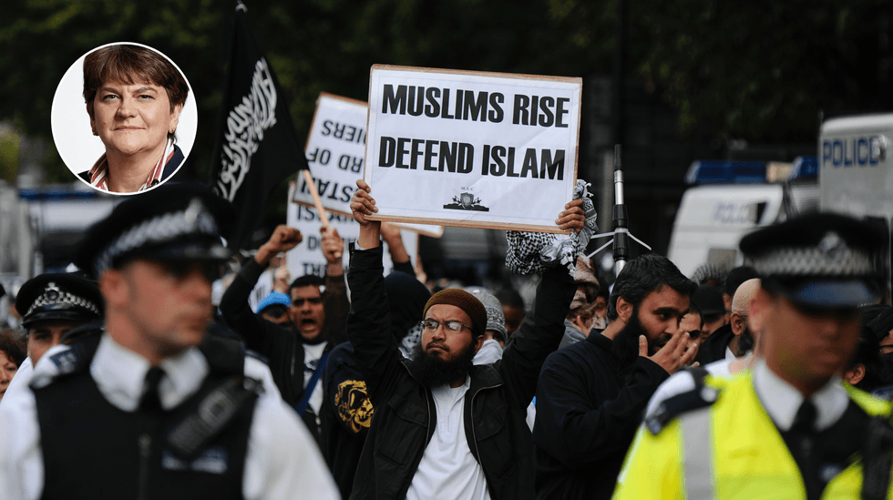 Police escort Islamist demonstrator marching to protest outside the US embassy in London on September 11, 2011 before a ceremony to mark the 10th anniversary of the 9/11 attacks on the United States.