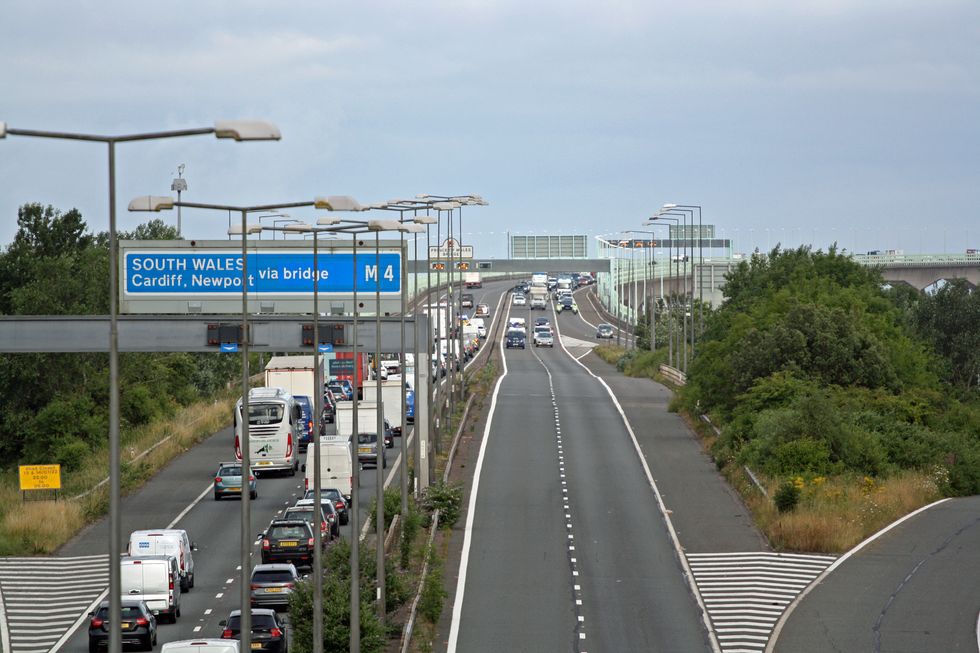 Police escort vehicles across the Prince of Wales Bridge, which runs between England and Wales, during the morning rush hour as drivers hold a go-slow protest on the M4. Police have warned of %22serious disruption throughout the day%22 as protesters target motorways in a demonstration over high fuel prices. The protests are understood to be organised via social media under the banner Fuel Price Stand Against Tax. Picture date: Monday July 4, 2022.