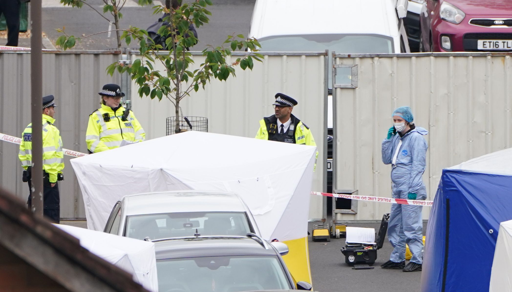 Police forensic tents outside a house in Bermondsey, south-east London, after three women and a man were stabbed to death in the early hours of Monday
