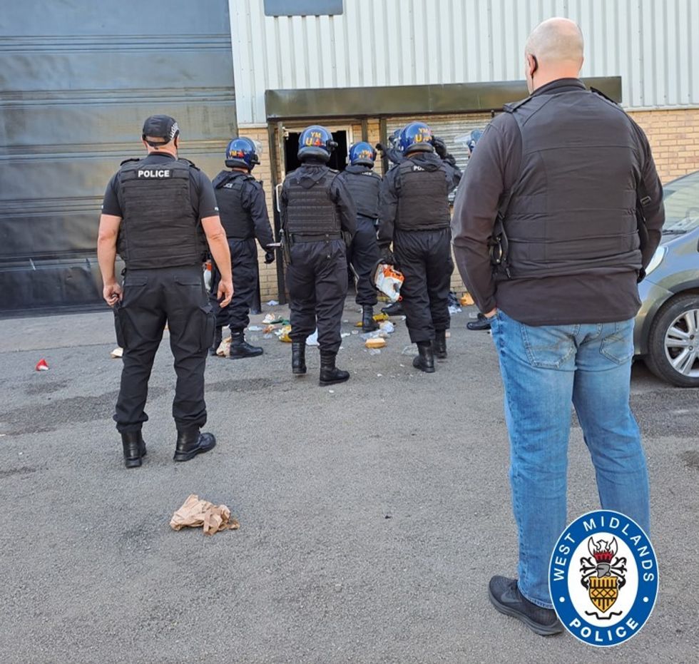 Police going into a chop shop