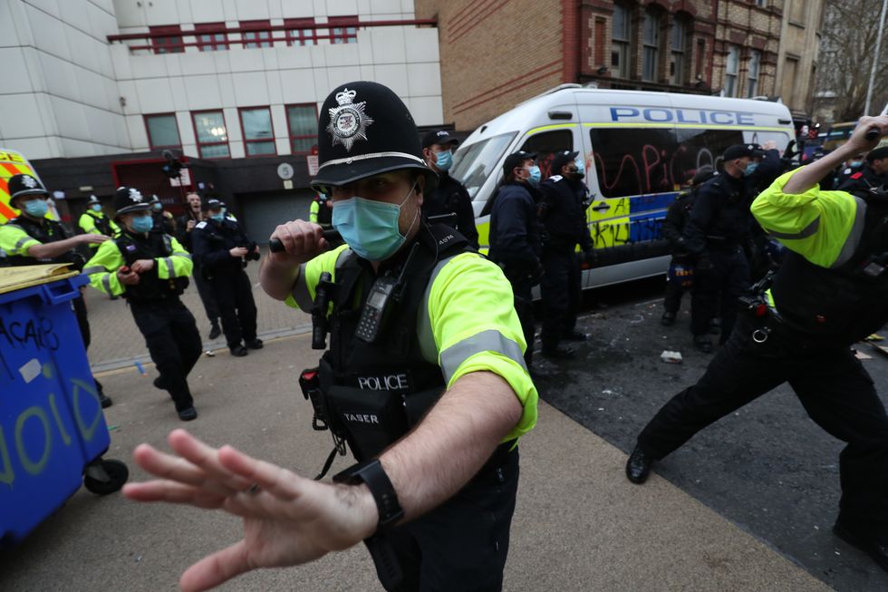 Police holding back people outside Bridewell Police Station as they take part in a 'Kill the Bill' protest in Bristol, demonstrating against the Government's controversial Police and Crime Bill.